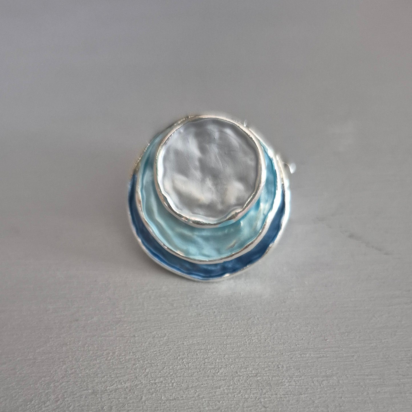 Decorative glass object on a gray wall