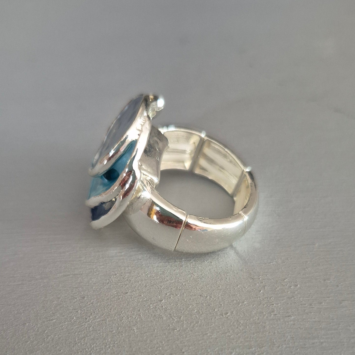 Silver ring on a gray background