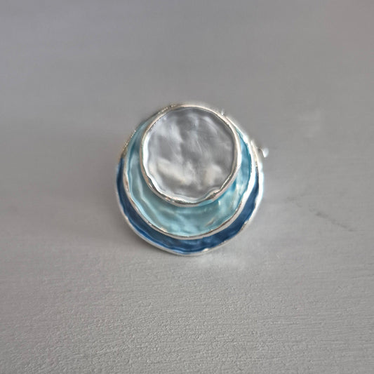 Decorative glass object on a gray wall