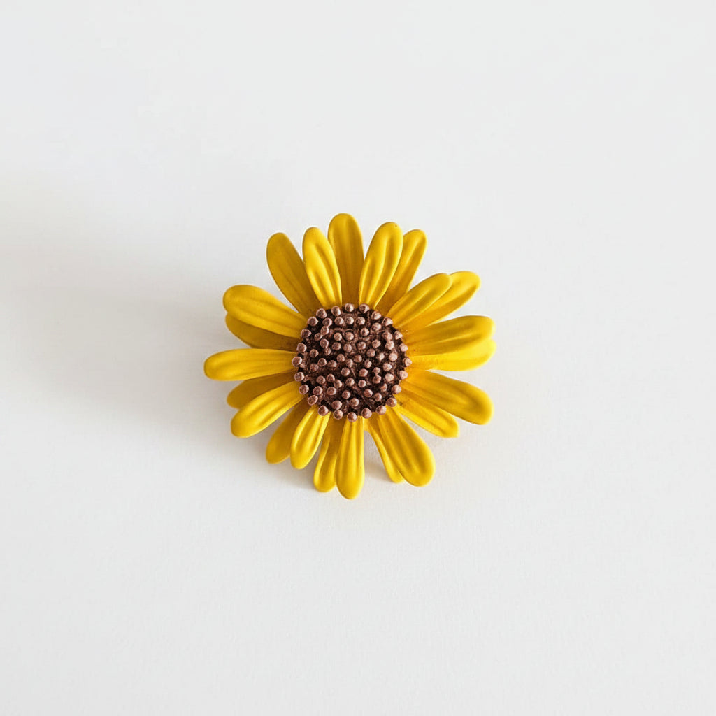 Yellow flower-shaped object on a gray background